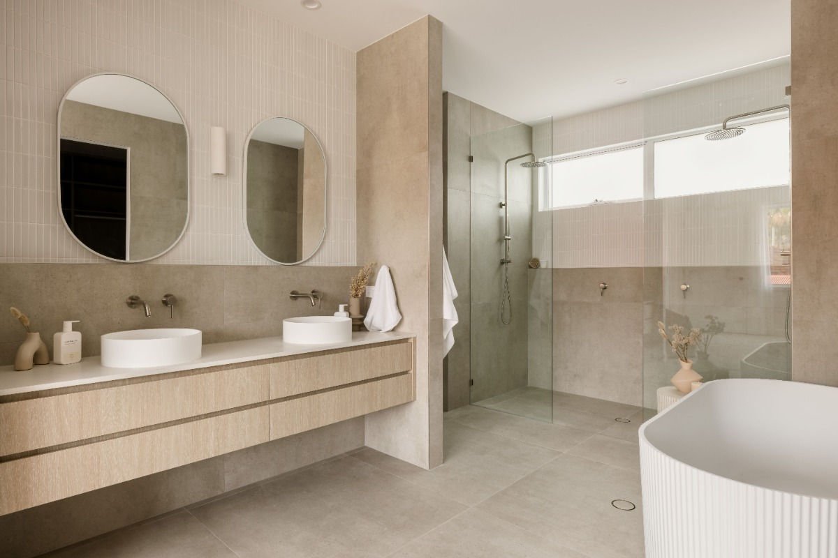 small modern bathroom with floating vanity and large mirror