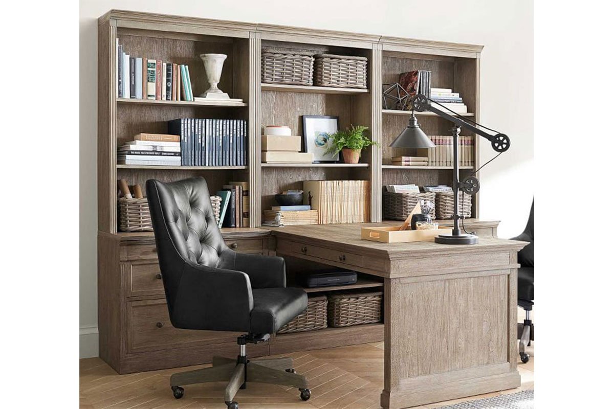 organized home office with desk chair bookshelf and storage