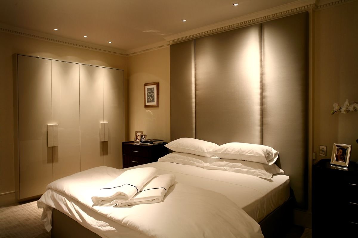 Cozy bedroom with warm layered lighting