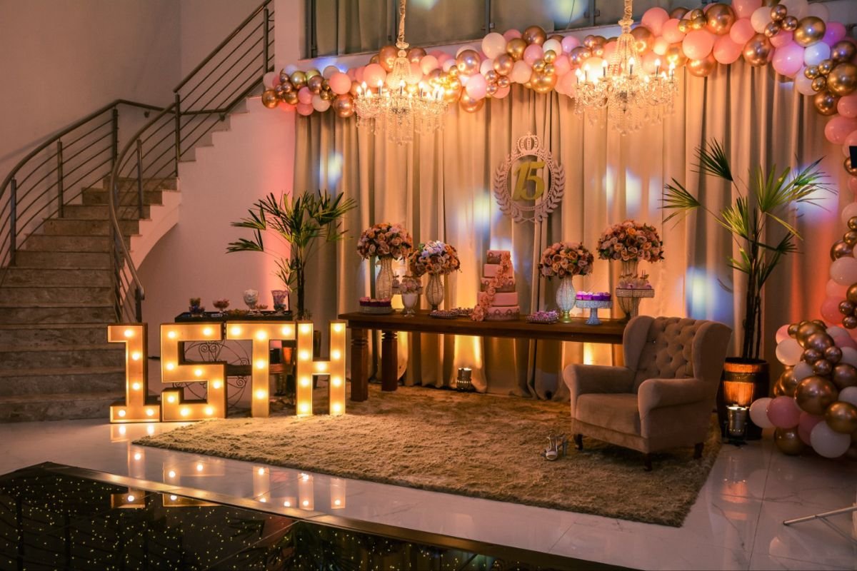 simple birthday decoration at home with balloons, lights and a decorated cake table