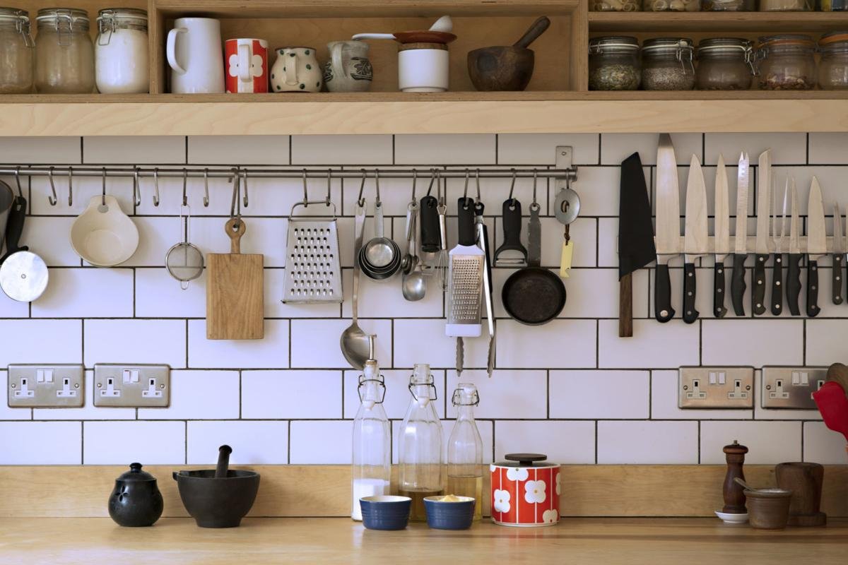 modern organized kitchen with stylish cabinets and worktop