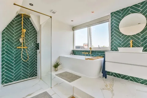 Remodeled master bathroom featuring diamond marble floor tiles and floating wood vanity.
